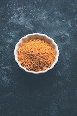 Aloo Bhujiya or Potato Bhujia also known as Namkeen sev. Popular Bikaneri recipe served in a bowl or plate. selective focus