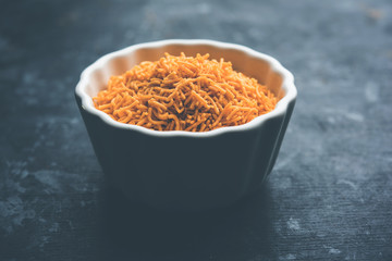 Aloo Bhujiya or Potato Bhujia also known as Namkeen sev. Popular Bikaneri recipe served in a bowl or plate. selective focus