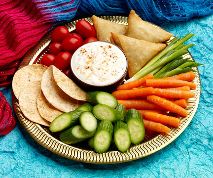 Indian Finger Food Platter with yoghurt dip on Brass plate