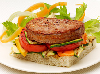 Vegetarian Burger on Focaccia Bread with Roasted Vegetables on plate