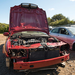 Big scrap car with bonnet up