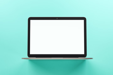 Blank white mock up screen of modern laptop at abstract turquoise background.