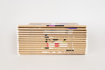 a stack of school notebooks on a white background
