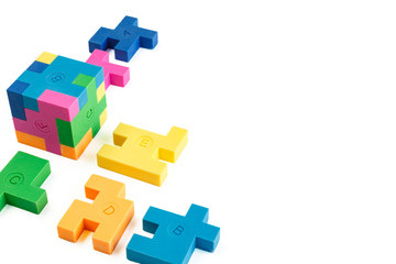 Cube puzzle of multi-colored rubber shapes. Concept of decision making process, creative, logical thinking. Logical tasks.
