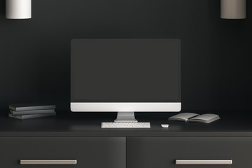 All black concept with modern workspace with personal computer, books and table.