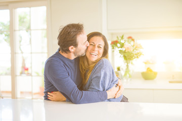 Romantic middle age couple sitting together at home