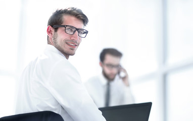 rear view.employees sitting at the office Desk