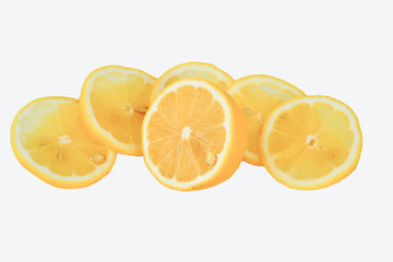 Fresh delicious yummy flavorful sour Golden yellow with seeds in the pulp of citrus lemon wedges on white background