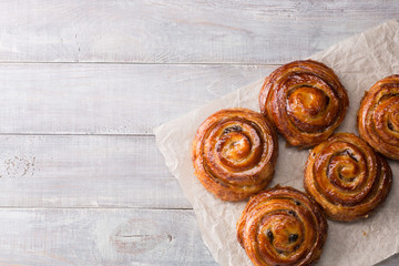 sweet pastries on a baking sheet. cakes on a wooden background
