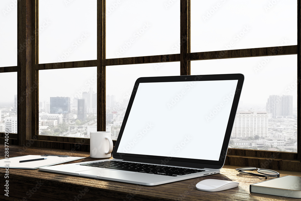 Poster blank white mock up laptop screen on wooden table in light space with megapolis view.