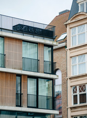 Contrast between modern and old styled architecture in Oostende, Belgium - Large glass covered walls and Flamand architecture