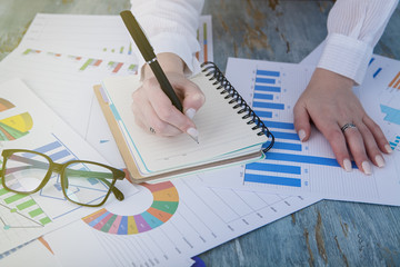 young business woman working with charts in office