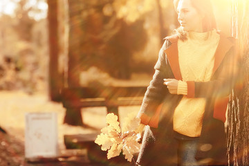 autumn view, people in the park on the background of autumn trees / beautiful autumn concept weather fall