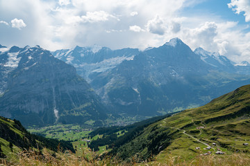 view from Grindelwald First down into the valley and on the mountains and a glacier