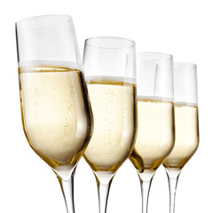 Four champagne glasses, close up