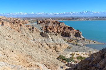 Dry desert badlands at the Lago Cuesta del Viento reservoir in San Juan, Argentina