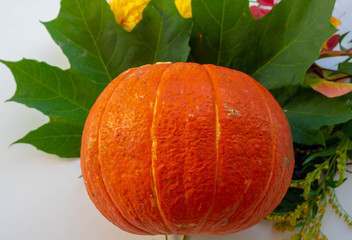 Autumn composition. Pumpkins, candles, dried leaves on white background. Autumn, fall, halloween concept. Flat lay, top view, copy space.
