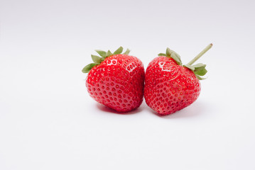 red tasty strawberries on a white background