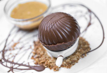 Melting chocolate sphere with caramel cream