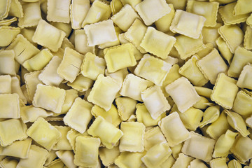 Obraz na płótnie Canvas Frozen ravioli sold by weight in supermarket, food industry background, selective focus
