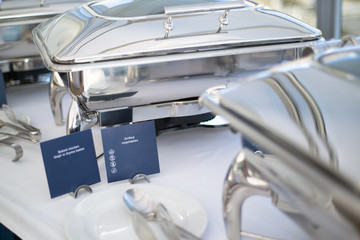 Catering buffet dishes plates table service with menu card