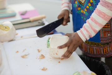 Fresh coconut drink fruit being cut and served