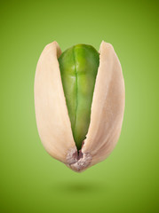 Pistachio on green background