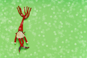 Christmas background. Christmas decoration on green backdrop. Top view, copy space.
