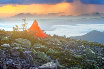 Red tent on top. it's raining