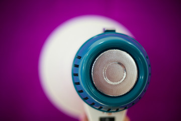 Woman holding megaphone on color background