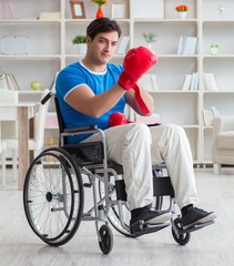 Disabled boxer at wheelchair recovering from injury