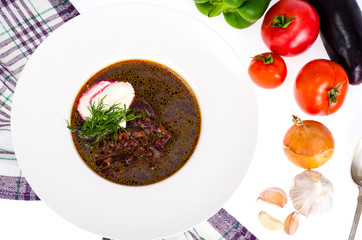 Vegetarian vegetable soup with beets in white plate
