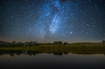 The river at night against the background of the starry sky
