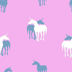 seamless background of silhouettes of unicorns on colored background