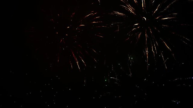 Beautiful, magnificent, red, silver and gold color of dazzling fireworks. Real firework of different colors and shapes. Ultra HD. 4K footage