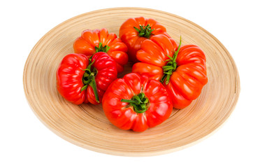 Red fresh beefsteak tomatoes on white background.