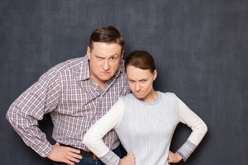 Portrait of angry and dissatisfied caucasian man and woman