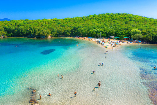 Aerial view of iconic paradise sandy beaches with turquoise sea in complex islands of Agios Nikolaos and Mourtos in Sivota area, Epirus, Greece