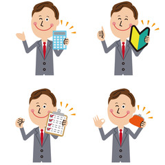 グレーのスーツの中高年　持ってポジティブポーズ