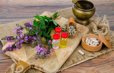 Pills and oil from medicinal plants. Photo