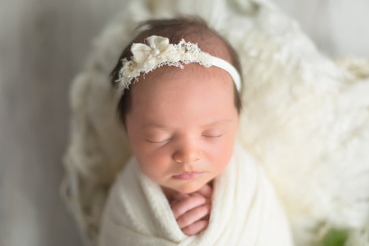 first photo shoot. newborn child. newborn.  the child lies in white . newborn girl