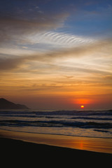 Fototapeta na wymiar Sunrise in a beach of Ubatuba, Sao Paulo, Brazil