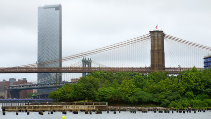 Famous Brooklyn and Manhattan bridges under East River in New York City.