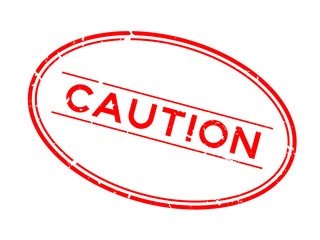 Grunge red caution word oval rubber seal stamp on white background