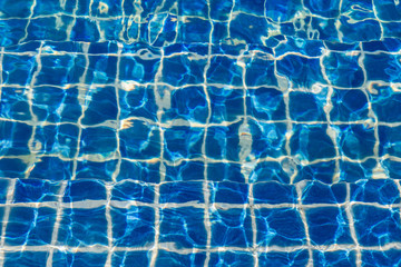 Blue color water in swimming pool rippled