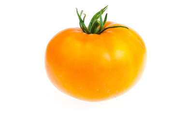 One yellow fresh bio tomato isolated on white background