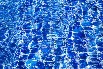 Blue color water in swimming pool rippled