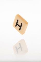 Alphabet H word block with white background.