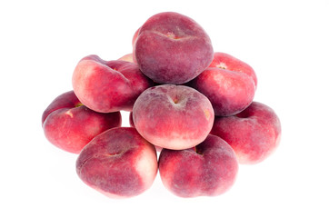Heap of sweet paraguaya peaches isolated on white background