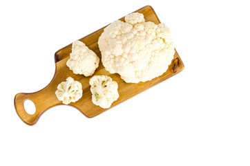 View of cauliflower on  cutting board, isolated.